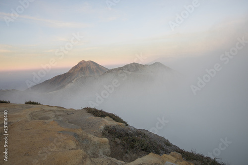 A smokey and active crater during sunrise at Mount Ijen volcano in East Java, Indonesia