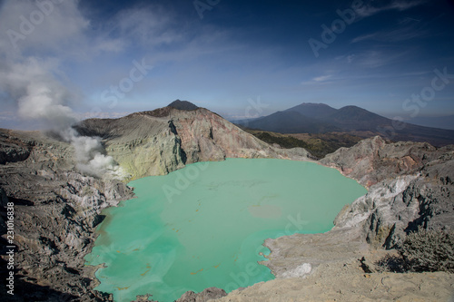 View of the Mount Ijen volcano and smoke from the crater around the sulfur lake in Java, Indonesia