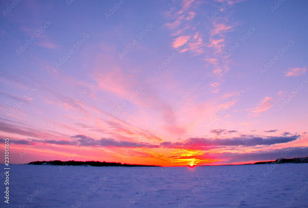 Winter sunset over frozen Baltic Sea in Finland Winter sunset over frozen Baltic Sea in Finland