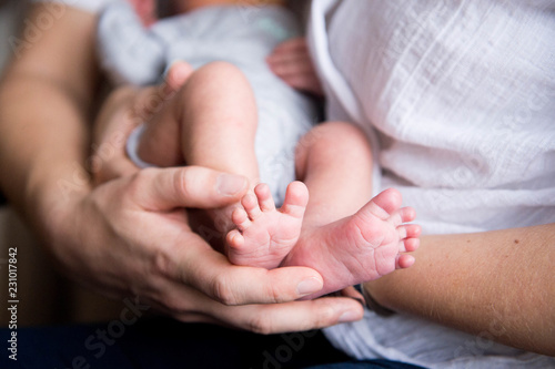 Baby Feet in Mother Hands Cute Newborn Birth