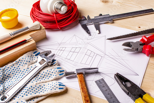 house drawing and working tools. concept of home improvement.