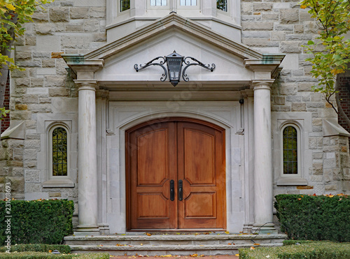 elegant double front door with stone columns