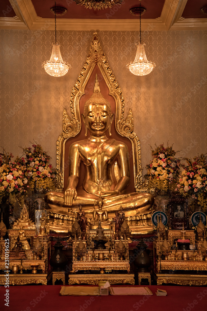 Close up indoor shiny golden buddha statue in buddhist temple in Bangkok, Thailand Close up indoor shiny golden buddha statue in buddhist temple in Bangkok, Thailand