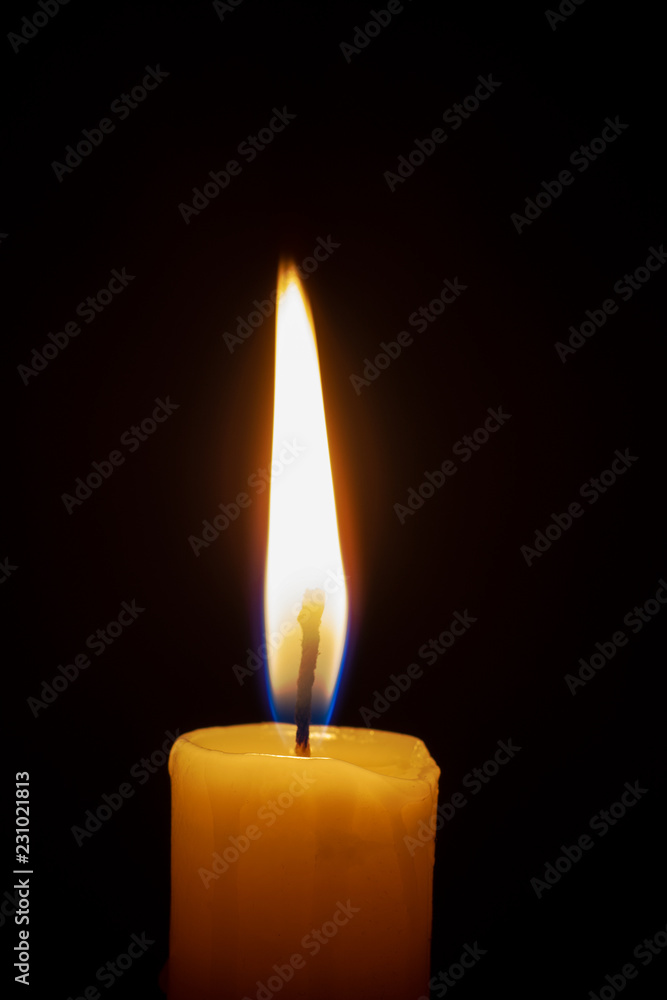 a lonely burning candle in the darkness a lonely burning candle in the darkness