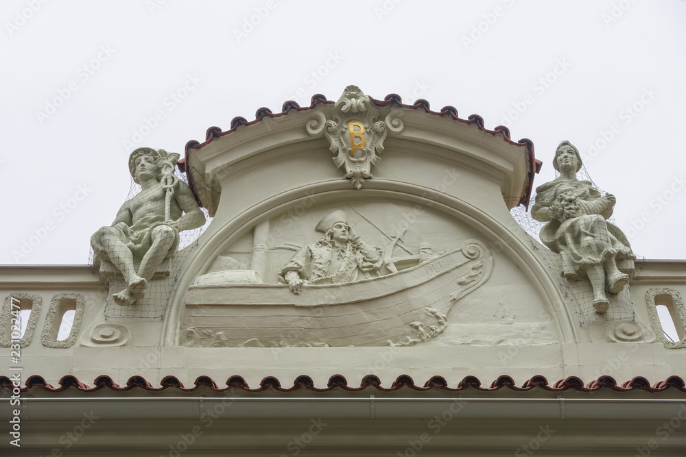 Close-up decorative pediment of old building in Prague, Czech Republic. Close-up decorative pediment of old building in Prague, Czech Republic.
