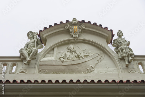 Close-up decorative pediment of old building in Prague, Czech Republic.