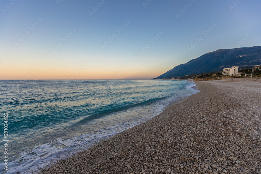 Tropical beach with white pebbles. in Albania.  Ionian Sea
