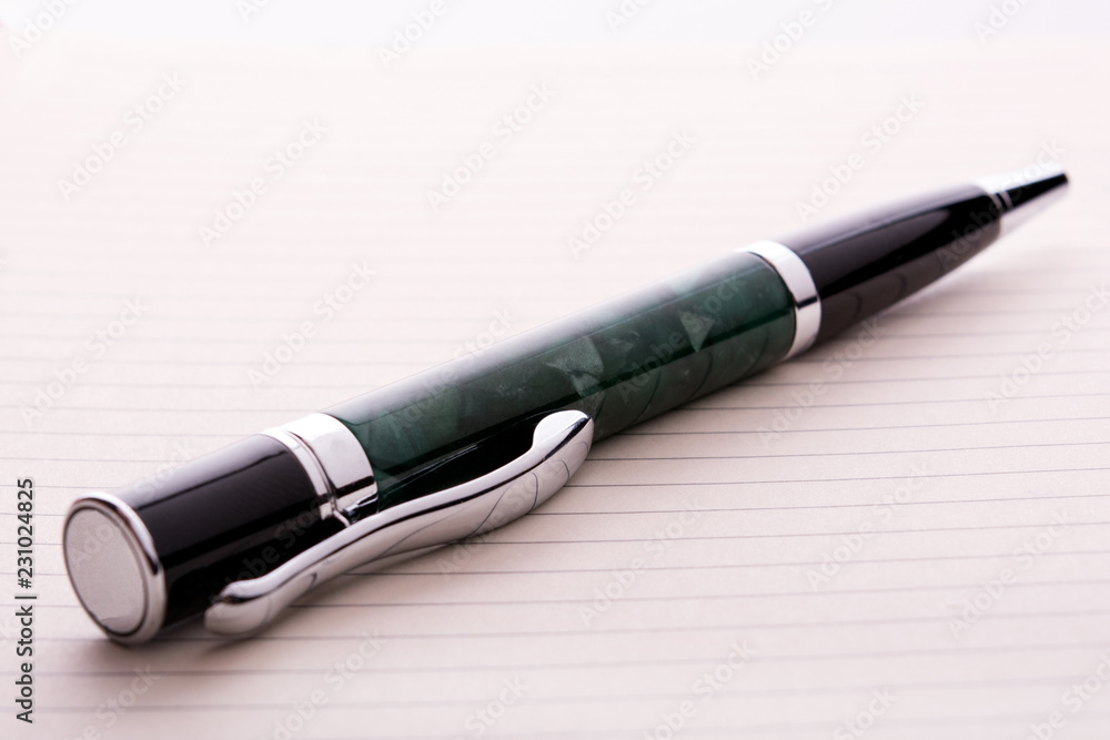 Fototapeta premium pen on a notebook