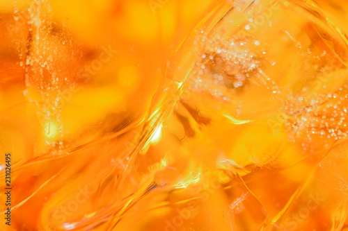abstract background from cubes of ice and whisky