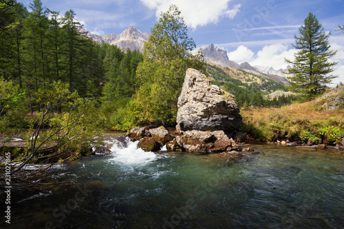 Clear river in the French alps mountains