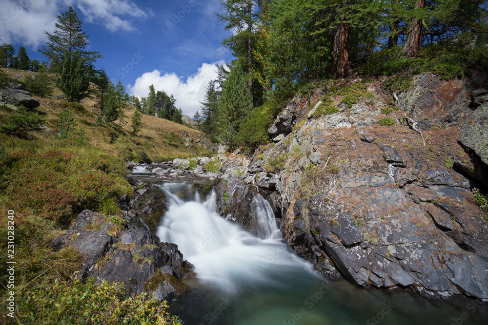 Small waterfall in the Alps mountains Small waterfall in the Alps mountains