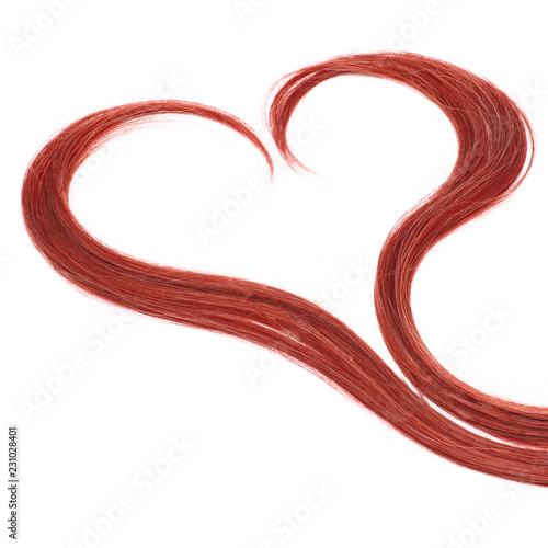 a strand of red hair in the shape of a heart on a white background, isolated