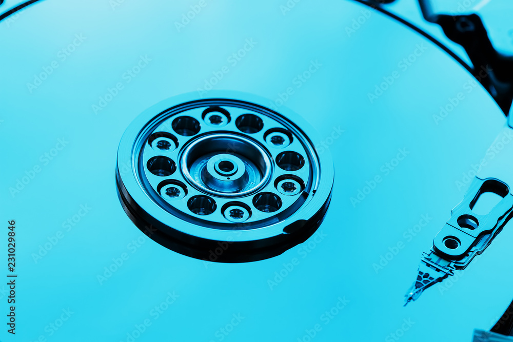 Disassembled hard drive from the computer, hdd with mirror effect. Opened hard drive from the computer hdd with mirror effects. Part of computer pc, laptop Disassembled hard drive from the computer, hdd with mirror effect. Opened hard drive from the computer hdd with mirror effects. Part of computer pc, laptop