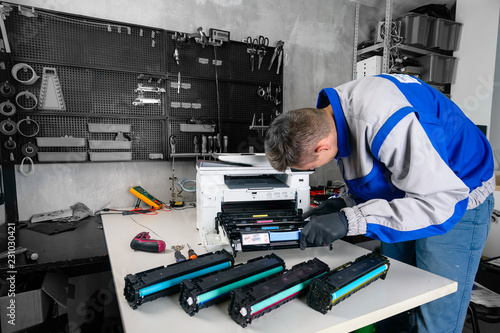 Foto master professional refills laser printer cartridges in the workshop