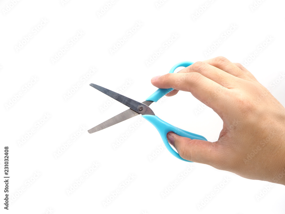 Hand holding a scissors isolated on white background. Hand holding a scissors isolated on white background.