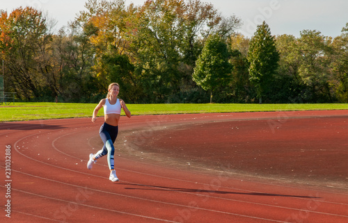 Healthy lifestyle young fitness woman running at outside