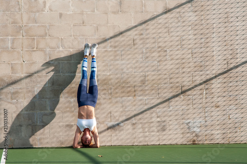 Healthy lifestyle and yoga concepts. Fitness woman in sportswear is doing exercise photo