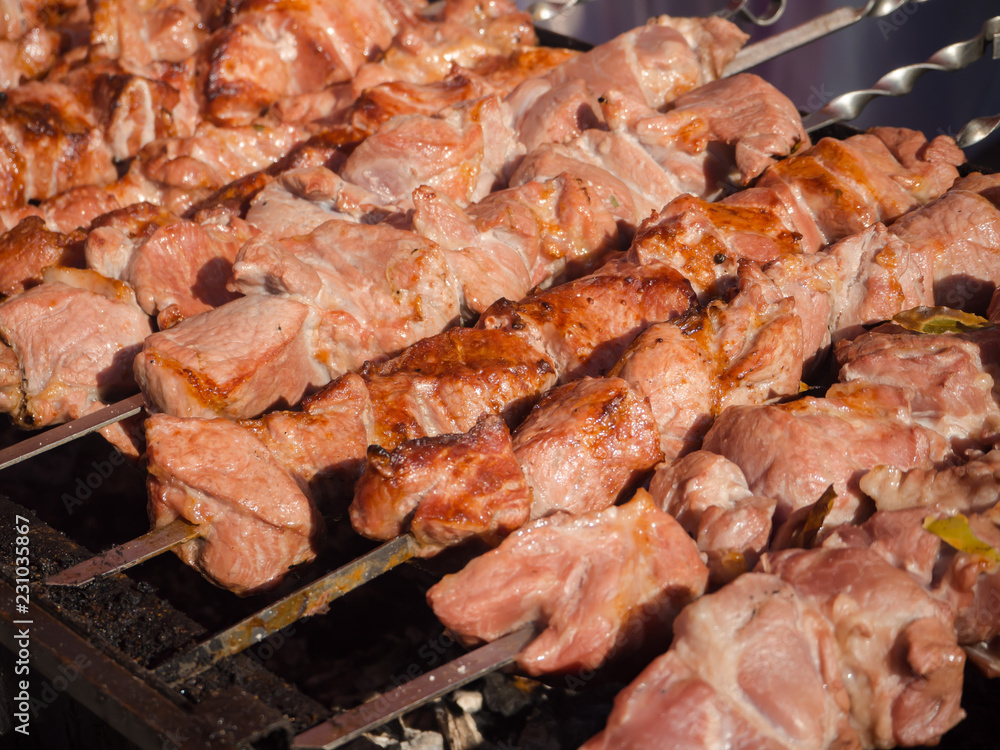 Cooking meat on the grill.