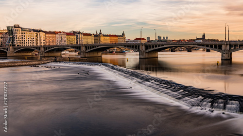 View from the river to Jirasek Bridge and the Vltava River. A sunny day at the Vltava river in Prague
