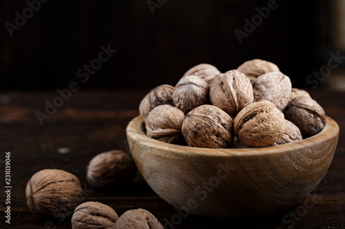 whole walnuts on a dark background