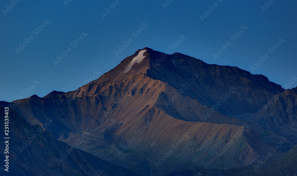 Early morning in the mountain area. Dawn over the mountains and valleys of the North Caucasus in Russia.