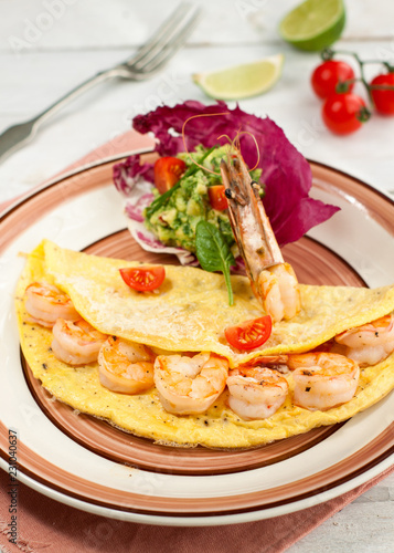 Omelette with shrimps and avocado salsa