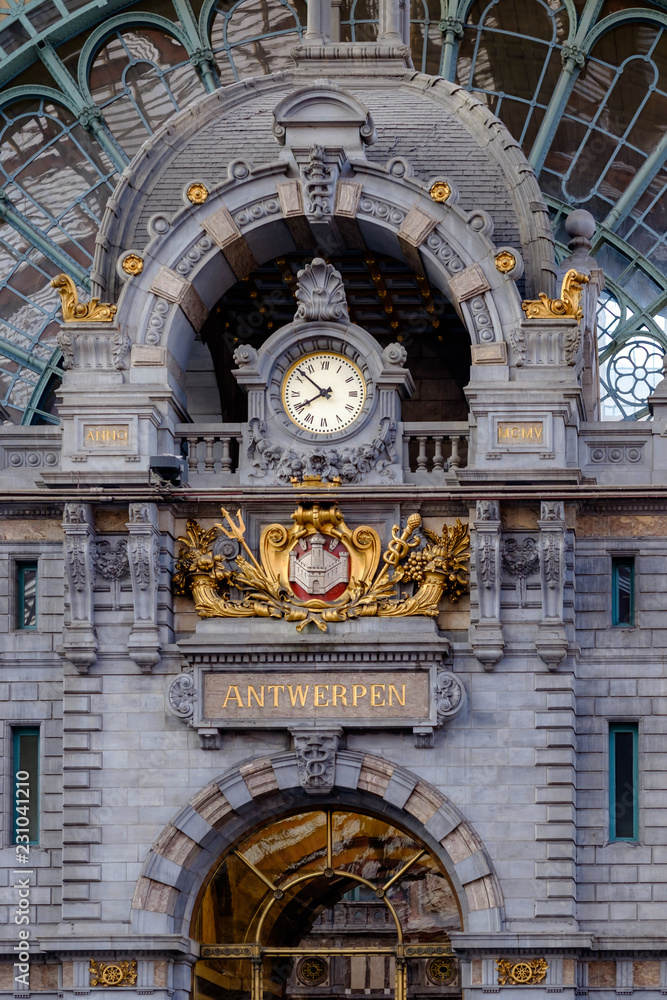 Clock at the upper level of the Central Station in Antwerp. The original building was designed by Clement Van Bogaert and was constructed between 1895 and 1905.
