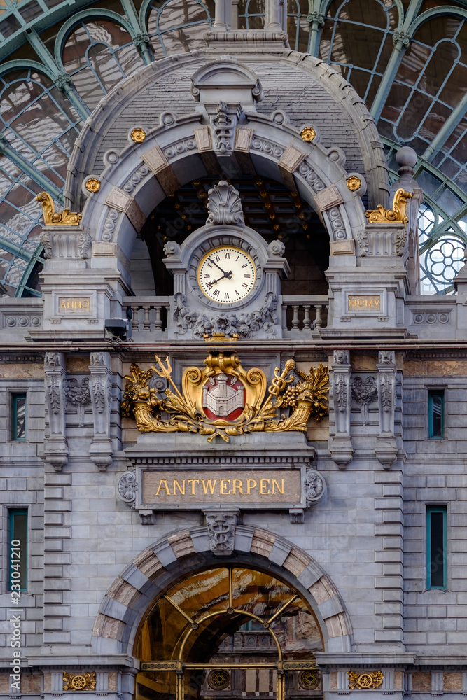 Fototapeta premium Clock at the upper level of the Central Station in Antwerp. The original building was designed by Clement Van Bogaert and was constructed between 1895 and 1905.