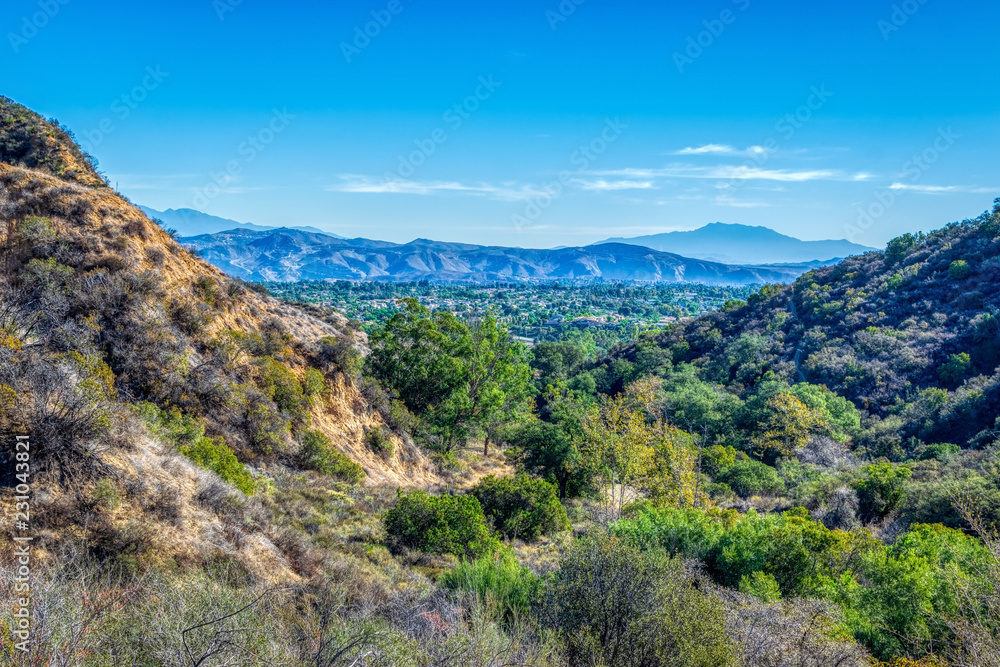 Fototapeta premium Suburbs below mountains of southwest on fall morning
