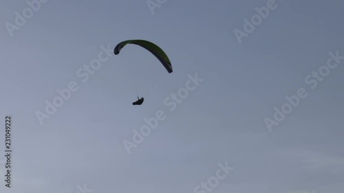 Flying paragliders. photo