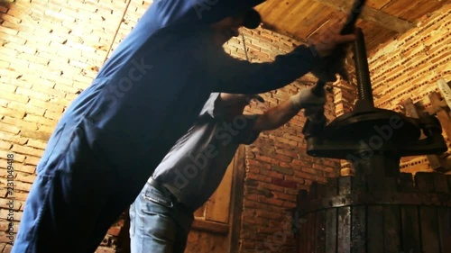 farmers making wine of grape in traditional winepress in Villarejo de Orbigo, Leon , Spain , hd video footage 1920x1080 photo