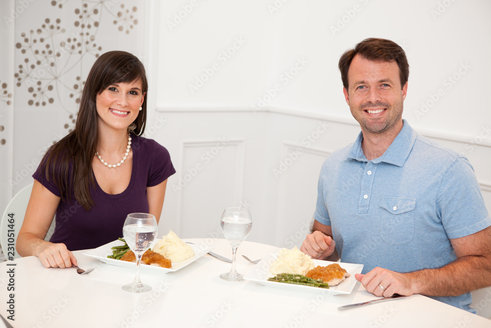 Young Couple Eating Dinner Together at Home