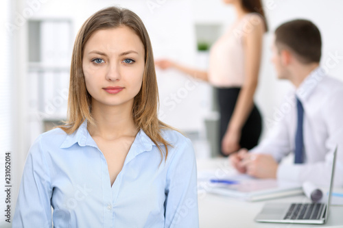 Portrait of a young business woman at meeting. Negotiation concept