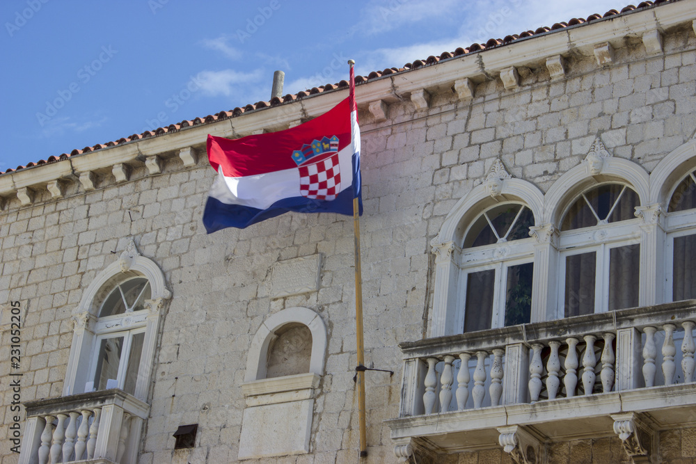 Trogir city hall windows with Croatian flag