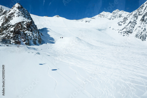 Winter landscape - Panorama of the ski resort with ski slopes. Alps. Austria. Pitztaler Gletscher. Wildspitzbahn photo