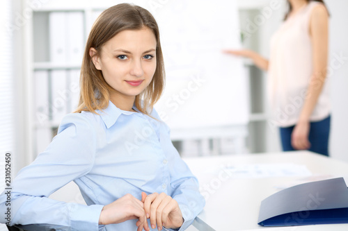 Portrait of a young business woman  at meeting. Negotiation concept