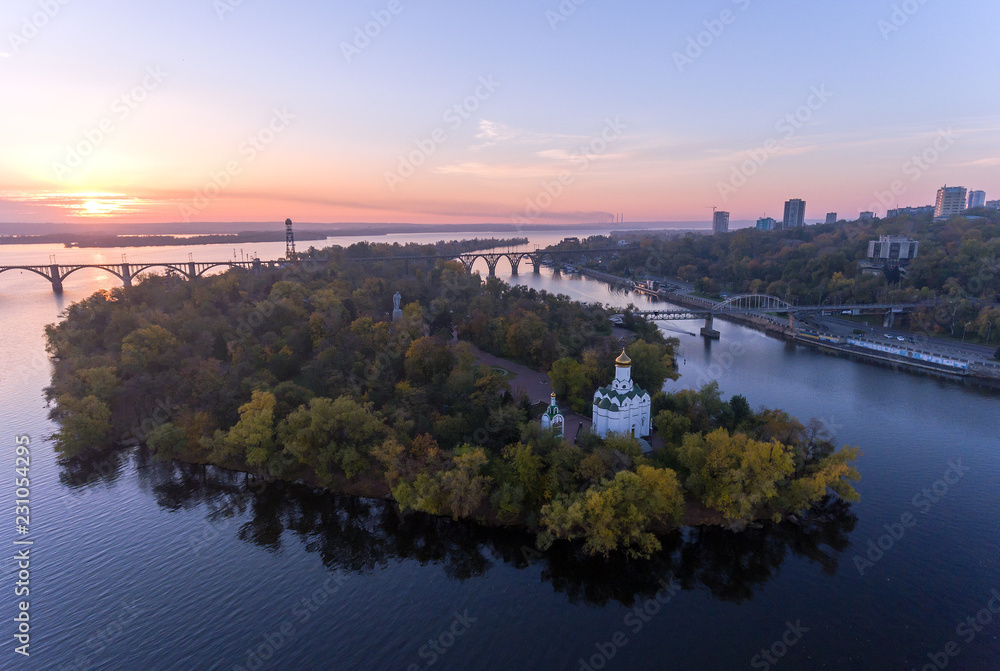 Fototapeta premium Aerial Flight over the Christian Church in the Monastic island, Dnepr City, Ukraine (Dnipro, Dnepropetrovsk, Dnipropetrovsk)