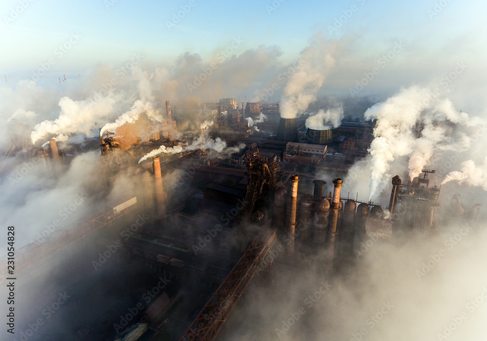 Industrial city of Mariupol, Ukraine, in the smoke of industrial plants and fog at dawn.