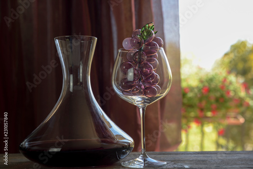 Quadro em tela Italian red wine inside the decanter and goblet with decorations