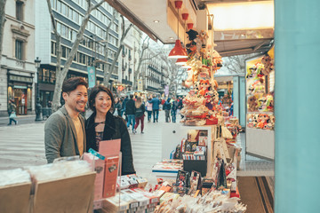 Asian couple shopping in barcelona