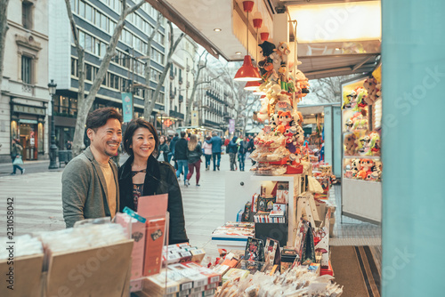 Photography Asian couple shopping in barcelona