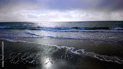 Beach Surf with clouds © heath