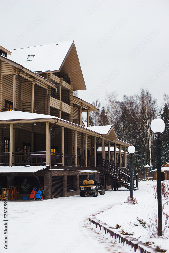 Fototapeta premium Beautiful house from a round timber. 