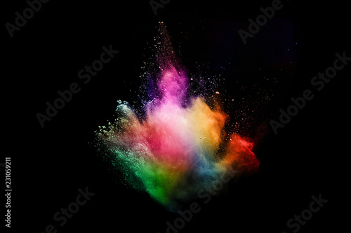 abstract colored dust explosion on a black background.abstract powder splatted background. © kitsana
