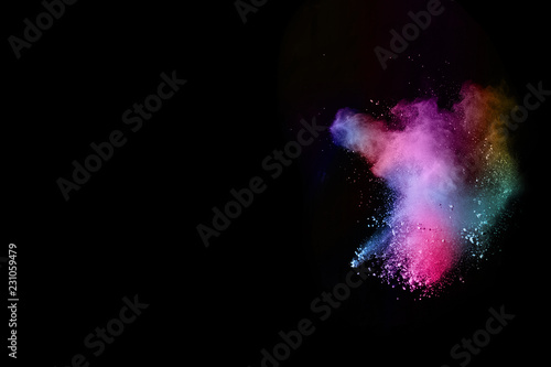 Fototapeta Naklejka Na Ścianę i Meble -  abstract colored dust explosion on a black background.abstract powder splatted background.