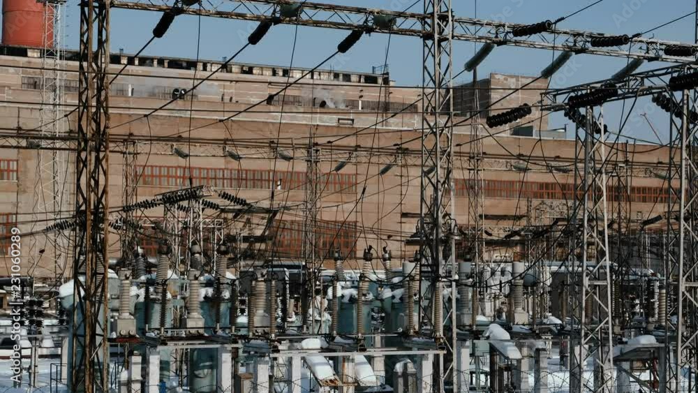 Thermal power station with wires and constructions on the industrial building background. Thermal power station with wires and constructions on the industrial building background.