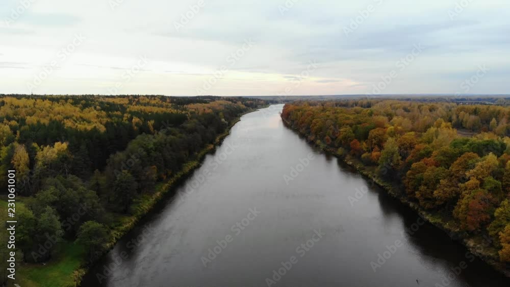 Aerial view. Flying over the river. Beautiful autumn day. The chamber is lowered down above the water surface. 4k Aerial view. Flying over the river. Beautiful autumn day. The chamber is lowered down above the water surface. 4k