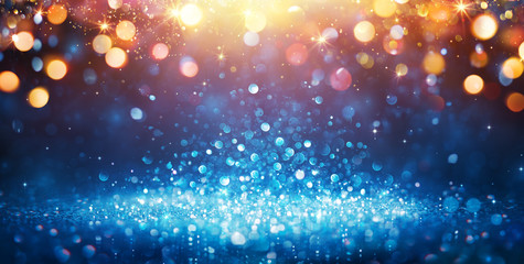 Abstract Glittering - Blue Glitter With Golden Christmas Lights And Shiny sparkling Background
