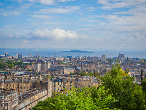 Beautiful view of Edinburgh, Scotland, UK and the Firth of Forth from Calton Hill on a bright sunny day.