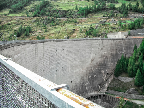 Beauregard Dam, a gravity arc construction, before the partial demolition which reduced the dam from 72 meters height to 20 meters height - Valgrisenche Village, Aosta Valley Province, Italy photo